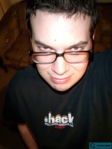 Smiling Man in Black Glasses