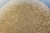 Golden Sphere with Intricate Linen Texture