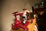 The Cool Doll on the Red Toy