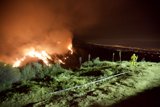 Brave Firefighter Surveys the Night Sky