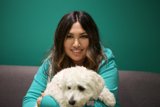 Green Shirt and White Dog