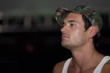 The Stylish Man in a Hat and Tank Top