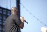 Black-shirted Man Belts Out Tunes