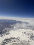 Soaring Above the Winter Peaks