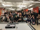 Group Shot in front of Pool Table