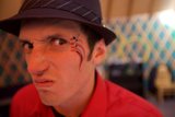 Face Painted Man in a Sun Hat