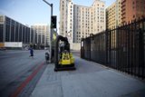 Construction Vehicle on the City Sidewalk