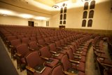 Red Chair Rows in a Crowded Auditorium