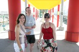 Three Friends at Colorful Transit Station Canopy