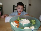 Inquisitive Boy Enjoys Vegetables