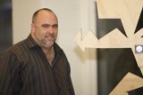 Standing Before Plywood Art