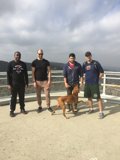 Four Men and a Canine Companion on a Santa Monica Bridge