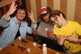 Three Friends Catching Up Over Drinks