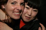 Two Friends Share a Warm Embrace at Night