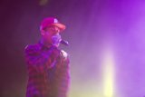 Tyga Rocks the Crowd in a Red Hat