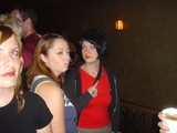 Three Friends Posing at a Dimly Lit Bar