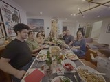 Family Thanksgiving Dinner Gathering Around Table