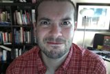 Portrait of Dave B among his personal library