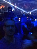Man with Glasses Stands Out in Nightclub Crowd