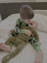 Brothers Sharing Sweet Moment on Bed