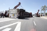 Truck Lifted by Crane