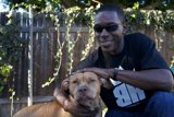 Man and Happy Dog by the Fence