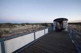 Desert Observatory Structure at Twilight with Indigenous Art