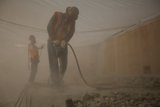 Construction Workers on Concrete Floor