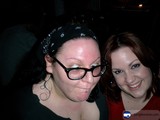 Two Women Strike a Pose in Glasses and Hats