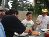 A Man Enjoying A Pizza Party