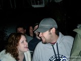 Couple in Baseball Caps Smiling at Each Other