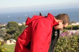 Man in Red Jacket by the Water