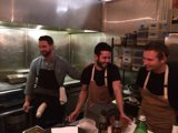 Three Men Preparing a Meal in a Restaurant Kitchen