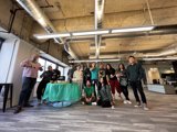 Group Gathering with Green Tablecloth