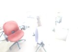 Blurry figure in a swivel chair