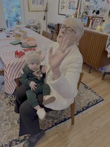 Grandmother and Baby Share Tender Kitchen Moment