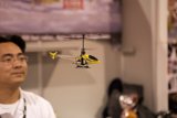 Marveling at the Helicopter Toy