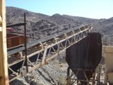 Conveyor belt in a mining facility