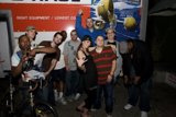 Group of Cycling Enthusiasts in Front of White Van