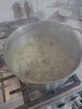 Steaming Onions Cooking in Kitchen Pan