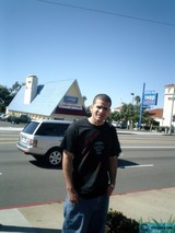 Man on a Street Corner with a Pickup Truck