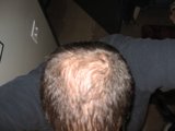 Balding Man on Plywood Couch