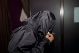 Mystery Hooded Figure