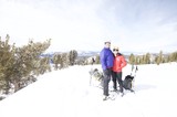 Couple Poses at Snowy Lake Tahoe Summit
