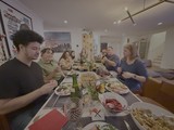 Family Thanksgiving Dinner Gathering Around Table