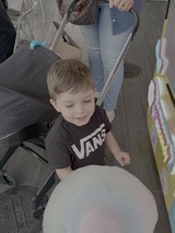 Young Boy Enjoying Carnival Game Experience