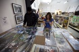 Photography Enthusiasts Browse Prints at Art Walk
