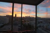 Urban Sunset from a High-Rise Window