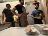 Three Men Enjoying a Meal Together