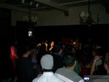 Nightclub Partygoers under a Glowing Chandelier
